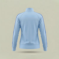 The back view of custom women's track jacket in light blue with royal blue sleeve stripe, made by ausman Pakistan