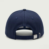 Back of navy custom embroidered cap showing adjustable steel buckle strap closure, manufactured by ausman