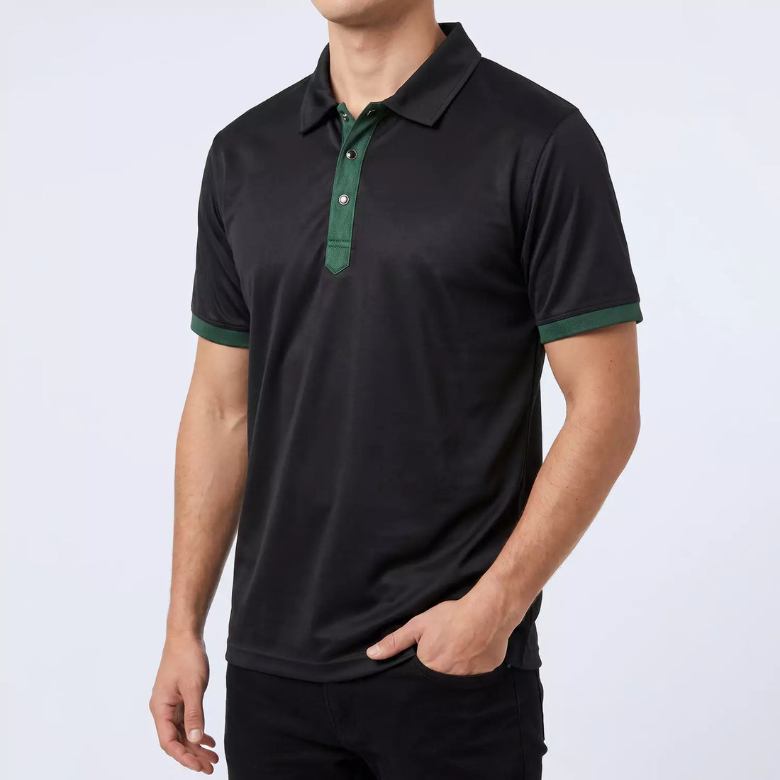 Ace Polo Shirt in black with a green contrast placket and cuffs, front view