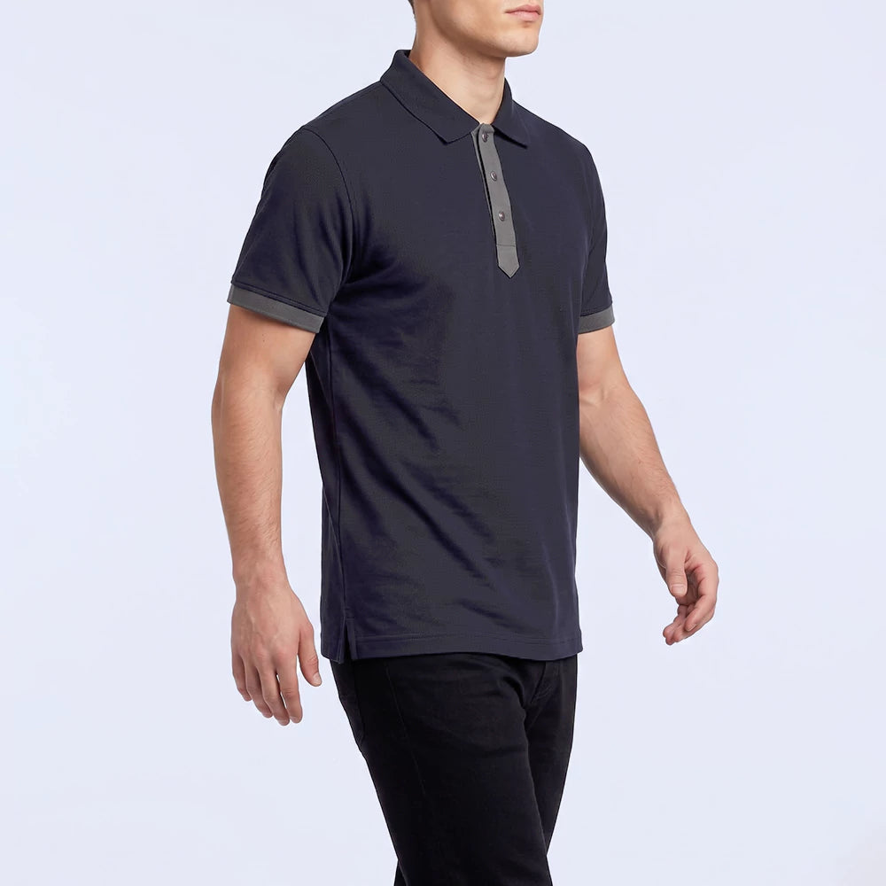 Man wearing the navy Baseline Polo Shirt, slim fit with contrast trim