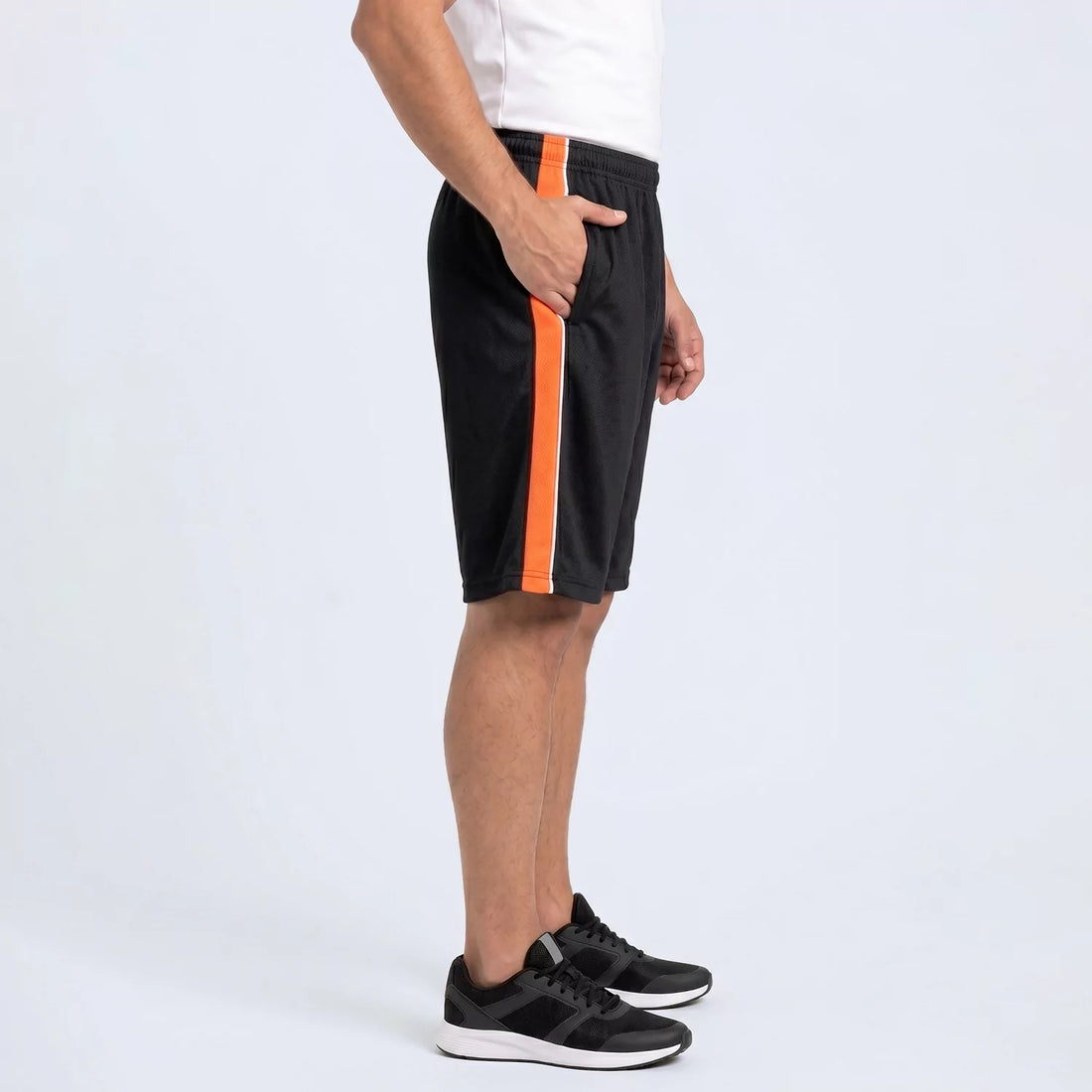 Blaze Panel Shorts in black with an orange side panel and white piping, front view