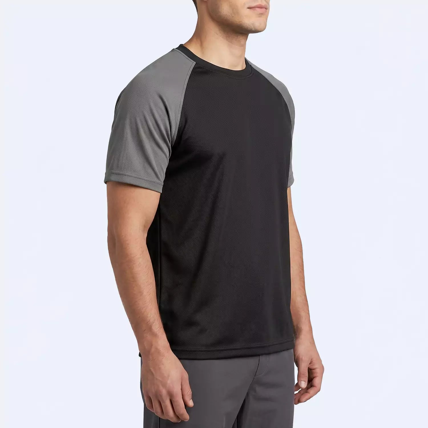 Man wearing the Drift Raglan T-Shirt, slim fit for gym and casual wear