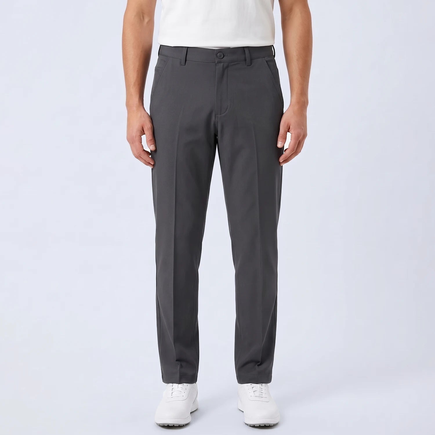 Parline Golf Pant in charcoal, front view showing the belt-loop waistband, button-and-fly closure, and slant pockets.