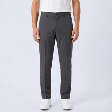 Parline Golf Pant in charcoal, front view showing the belt-loop waistband, button-and-fly closure, and slant pockets.