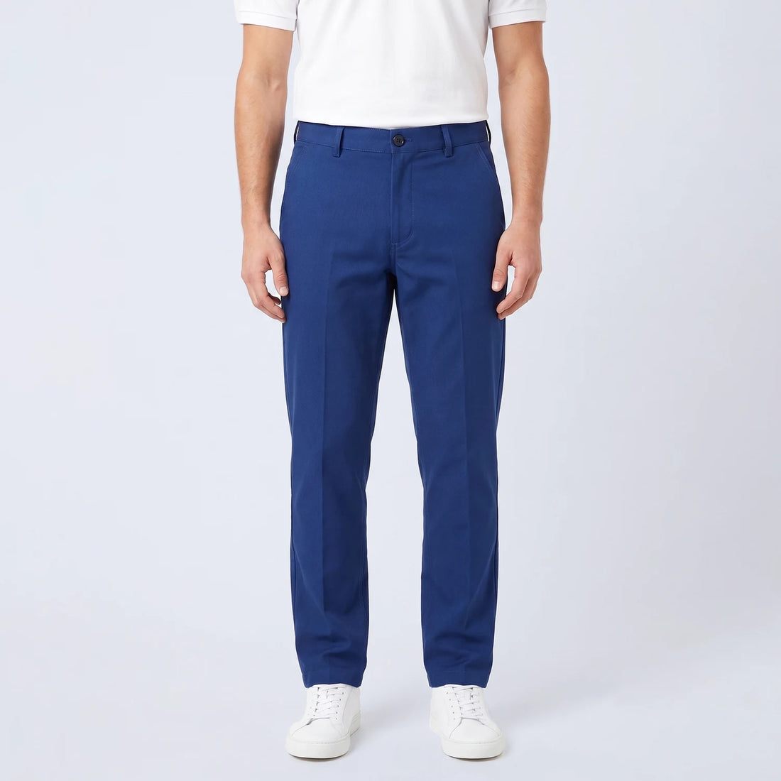 Parline Golf Pant in navy blue, front view showing the belt-loop waistband, button-and-fly closure, and slant pockets.