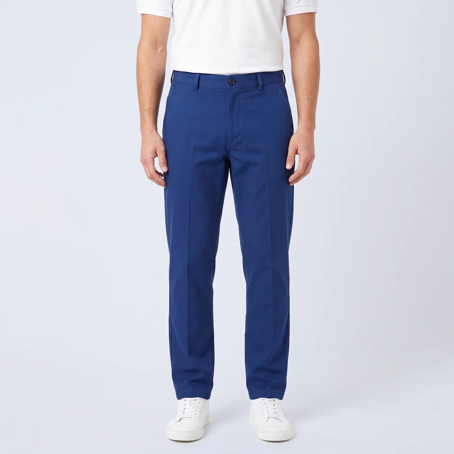 Parline Golf Pant in navy blue, front view showing the belt-loop waistband, button-and-fly closure, and slant pockets.