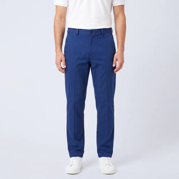 Parline Golf Pant in navy blue, front view showing the belt-loop waistband, button-and-fly closure, and slant pockets.