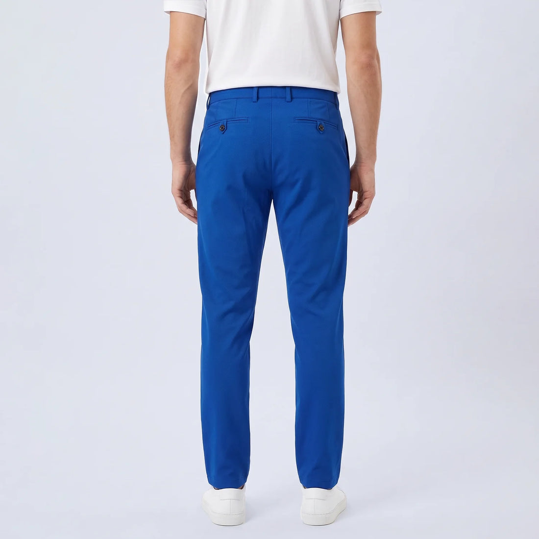 Parline Golf Pant in royal blue, front view showing the belt-loop waistband, button-and-fly closure, and slant pockets.