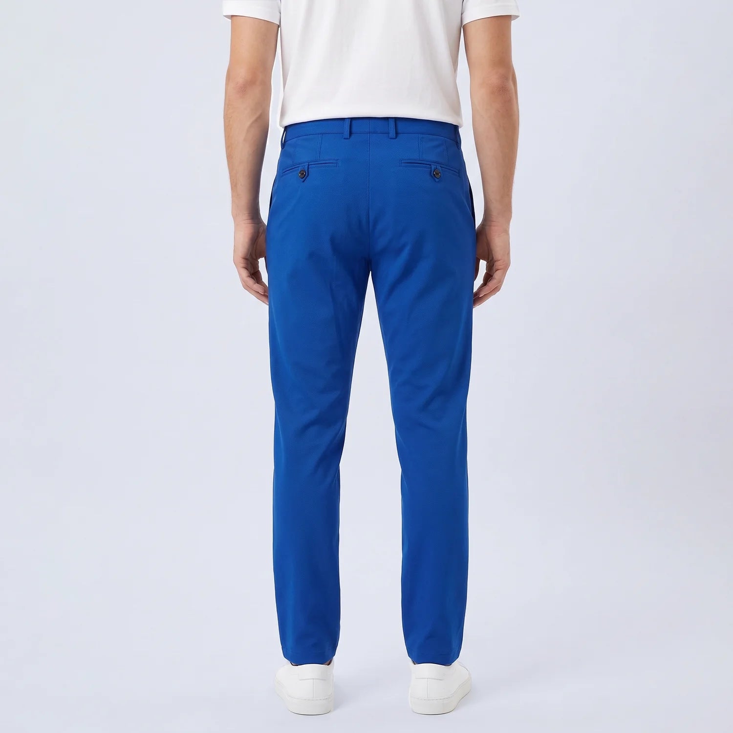 Parline Golf Pant in royal blue, back view showing the back pockets and tailored cut through the seat and legs.