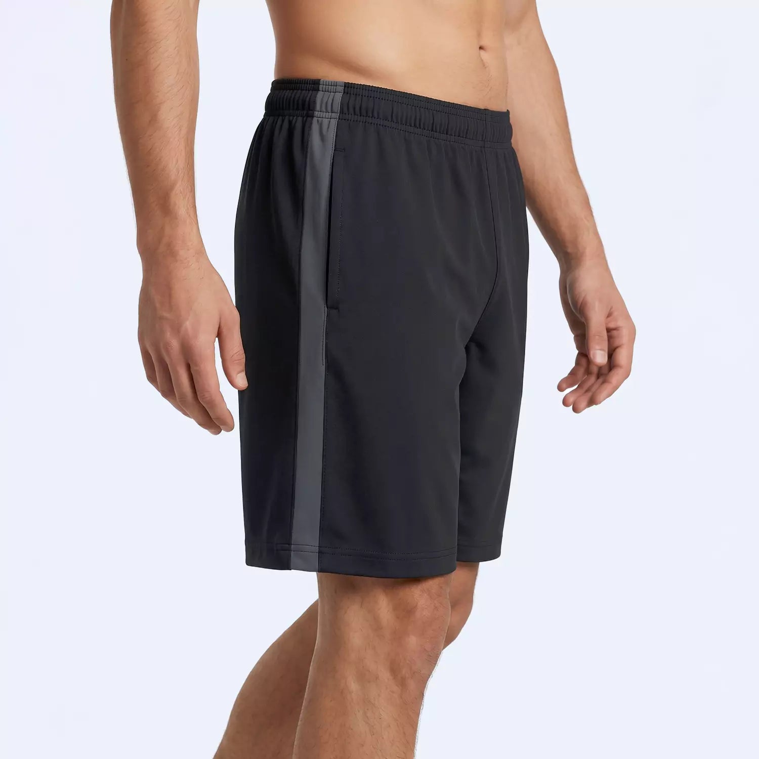 Man wearing the black Slate Panel Shorts, showing the drawstring waist and side panels